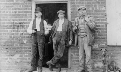 Sid Wilch with 2 friends outside the pub door