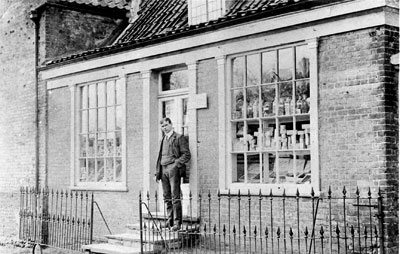 Albert Fairhead outside the shop in 1933