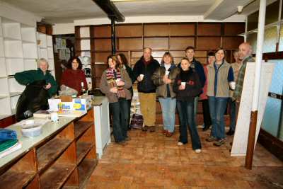 Volunteers with celebratory drink 28th February 2004