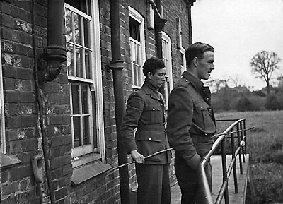 Sgt. Hoots (Canadian) with fishing rod and Scottie Torrence - 1942 