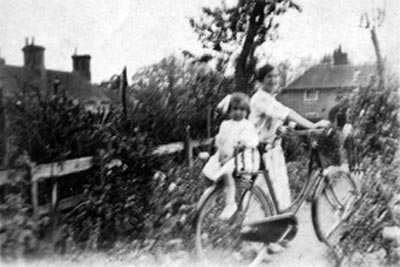 Yvonne Winifred Baxter on bicycle c.1926
